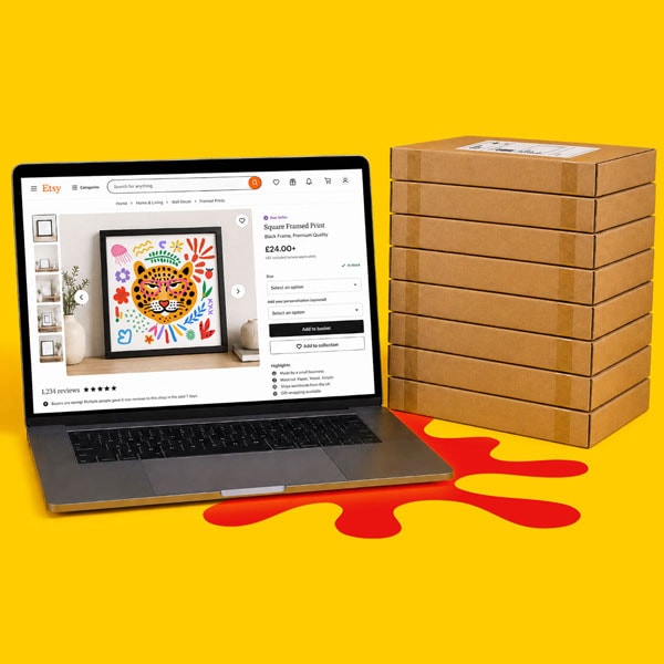 Laptop displaying art print on Etsy next to a stack of cardboard packages on yellow background.