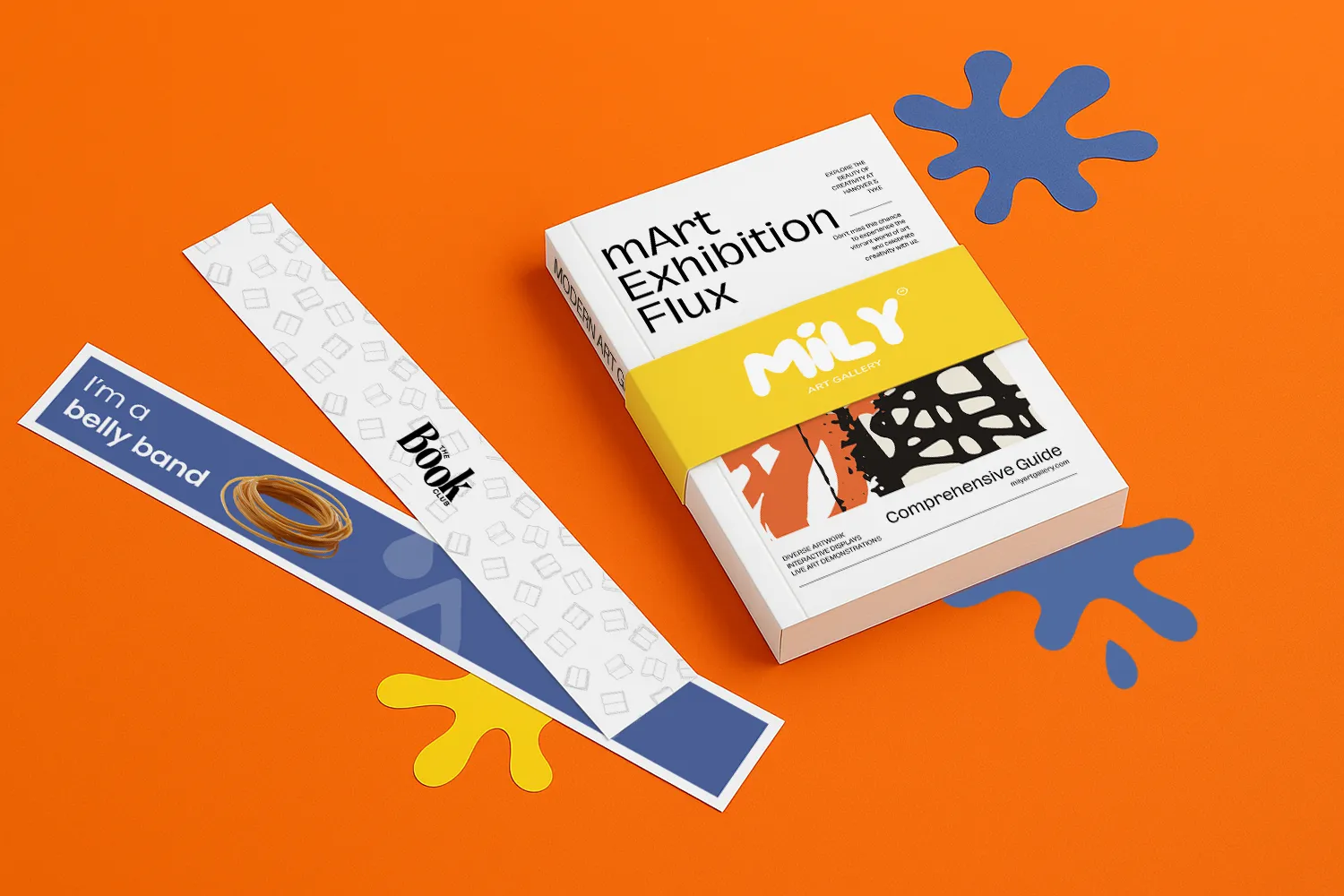 A book with a yellow belly band and two unwrapped belly bands on an orange surface with blue ink splats.