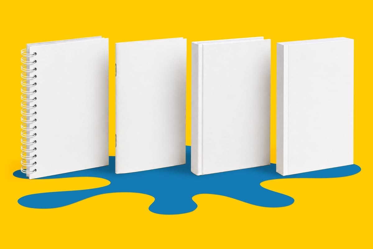 Four blank white books stand upright on a yellow background with a blue shape beneath.