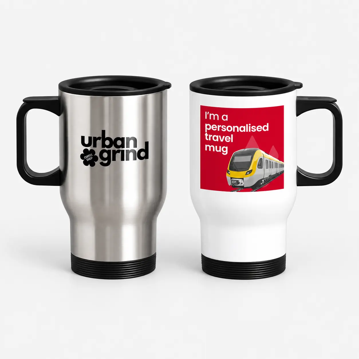 Two travel mugs, one silver with an “Urban Grind” logo and one white with a train illustration.