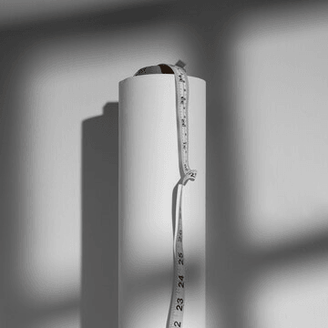 A rolled roller banner with a measuring tape for custom sizing