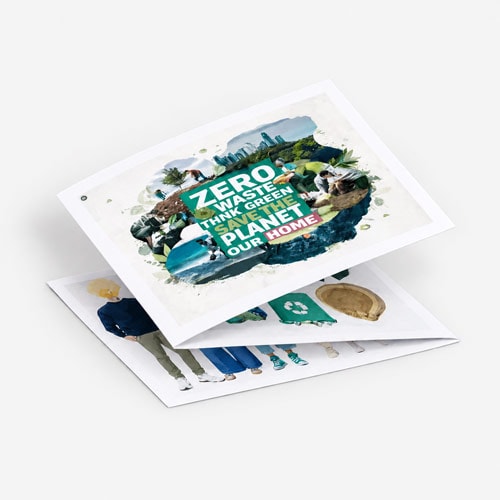 A folded recycled leafle displays "Zero Waste, Think Green, Save Our Planet, Our Home" with eco-themed images.