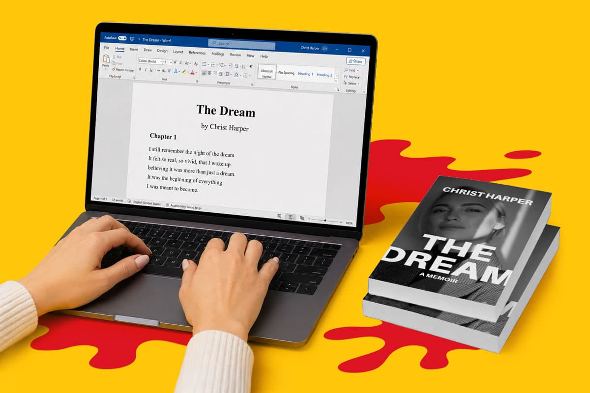 Hands typing on a laptop with a book draft onscreen and a printed book titled "The Dream" nearby.