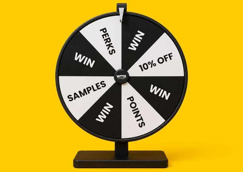 Black and white prize wheel with sections for perks, samples, points, 10% off, and win.