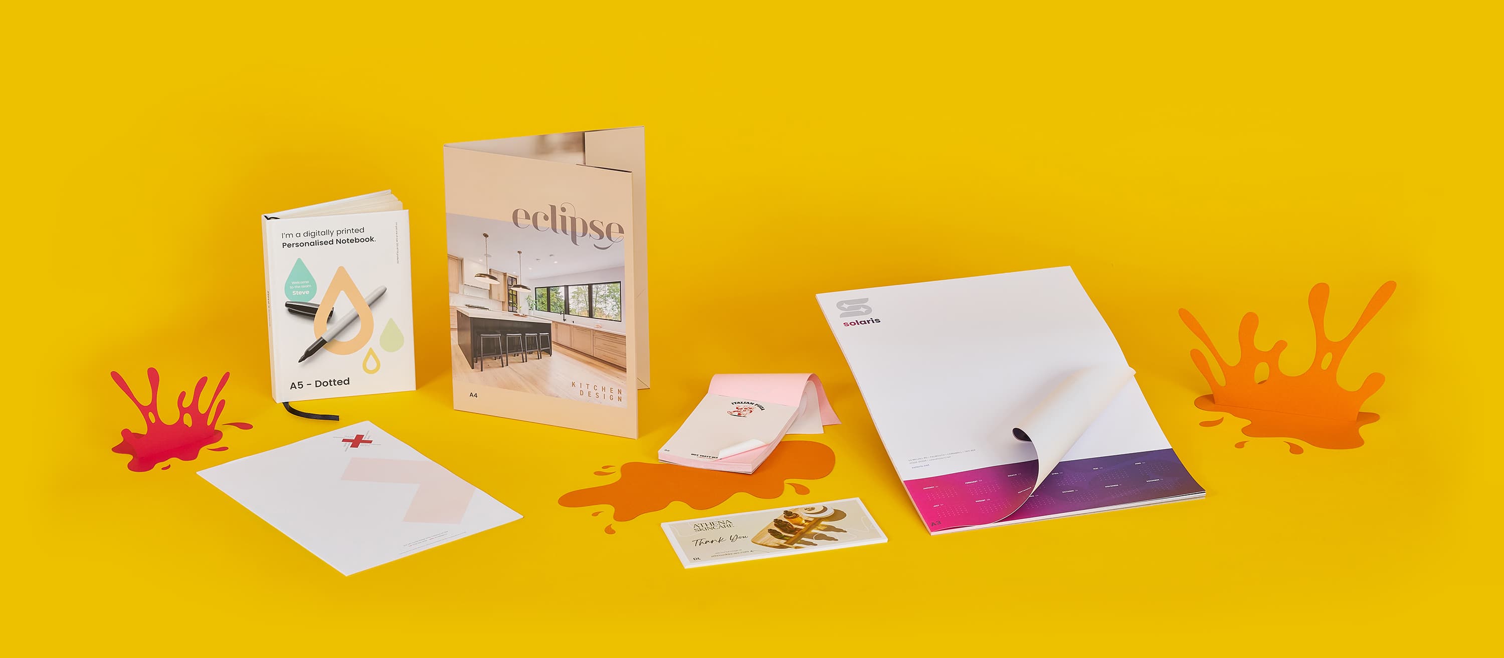 Assorted colorful brochures and cards on a yellow background.