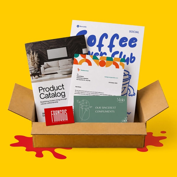 An open box with catalogs, brochures, a letter, and a red card on a yellow background.