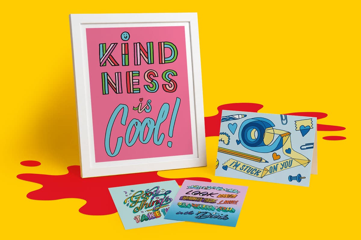 Framed "Kindness is Cool!" print with three colorful illustrated cards on a yellow background.