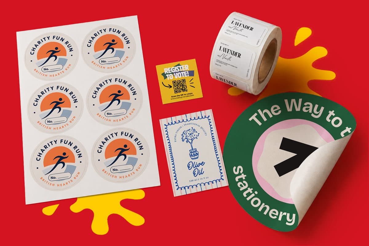 Assorted custom stickers and labels displayed on a red background with a yellow paint splash.