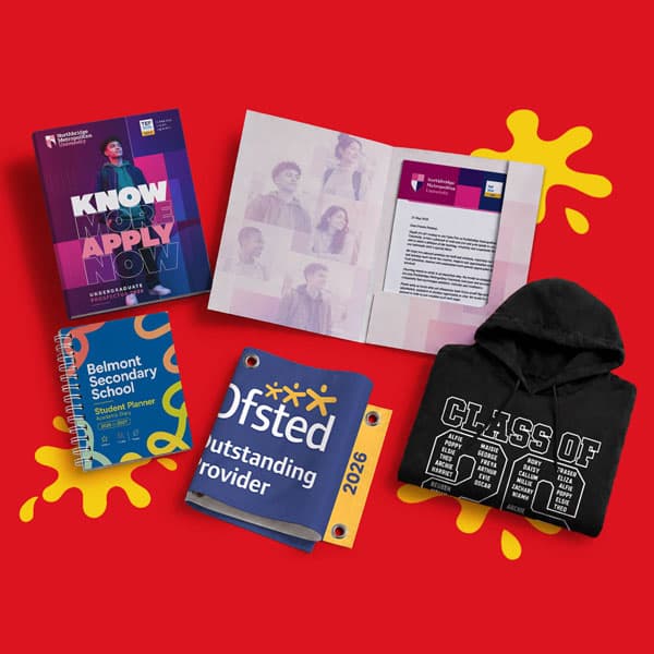 Uniform and school materials on red background, including a hoodie, planner, brochures, and flags.