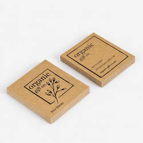A stack of brown kraft square shaped cards.