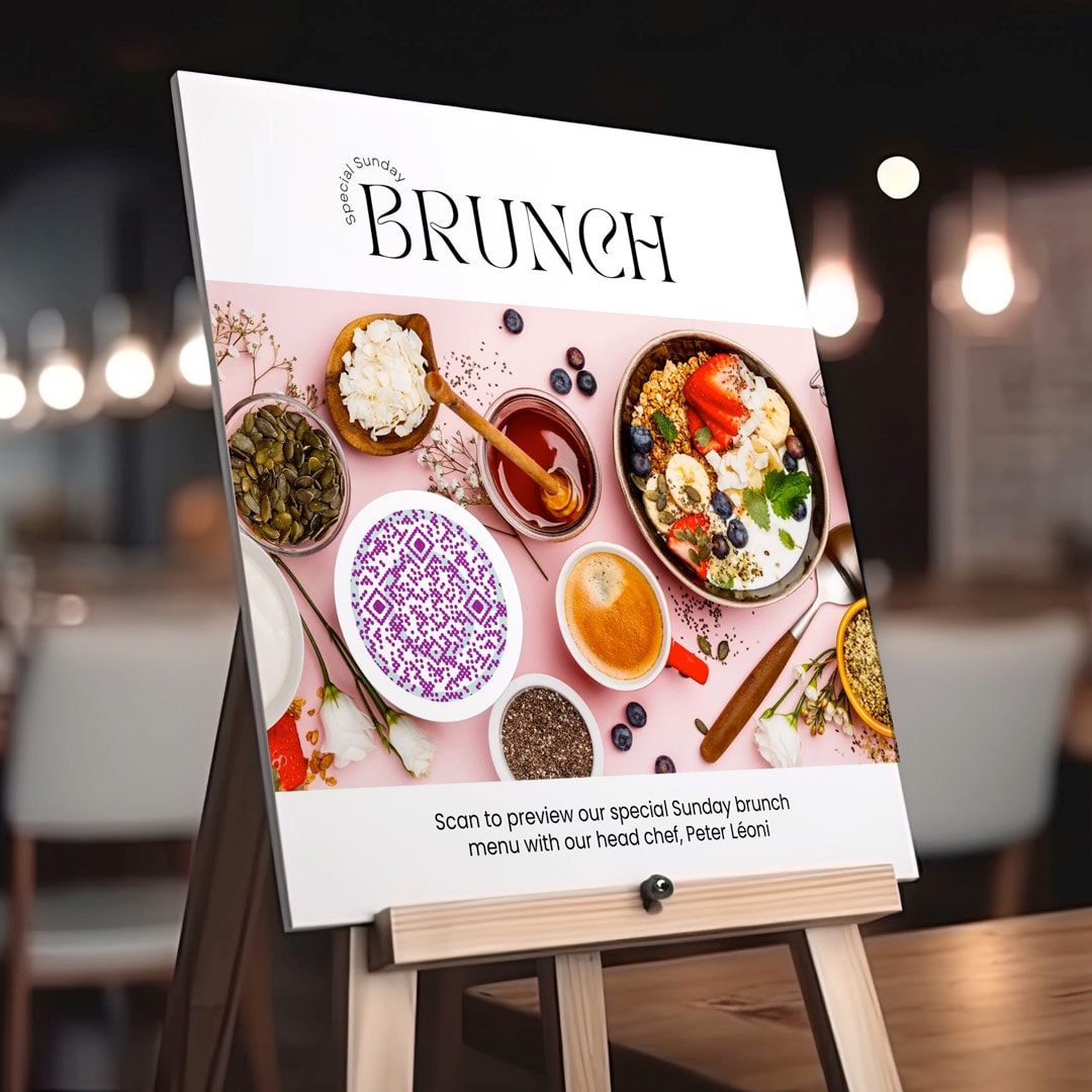 A menu foam board with a scannable QR code for previewing the brunch offerings.