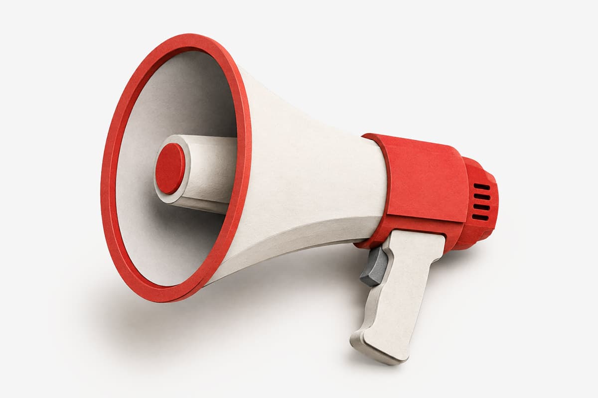 A red and white megaphone on a plain white background.