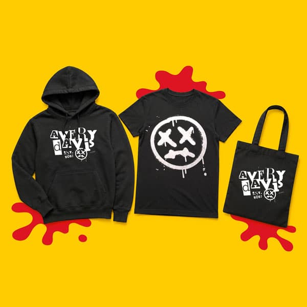 Black hoodie, T-shirt, and tote bag with white graphics on a yellow background with red splatters.