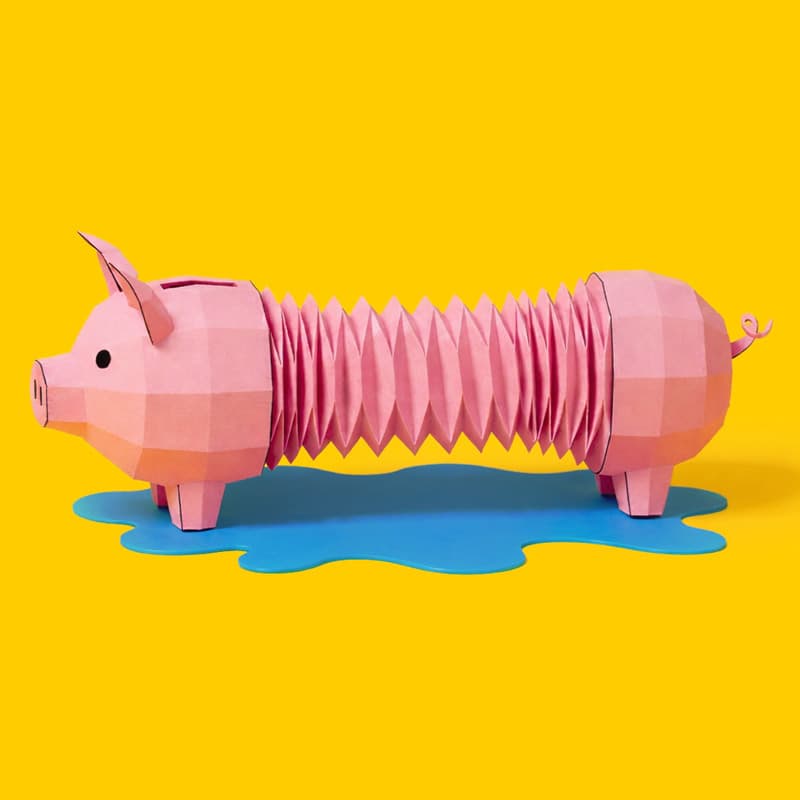 Paper piggy bank with accordion-like body on a blue puddle, set against a yellow background.