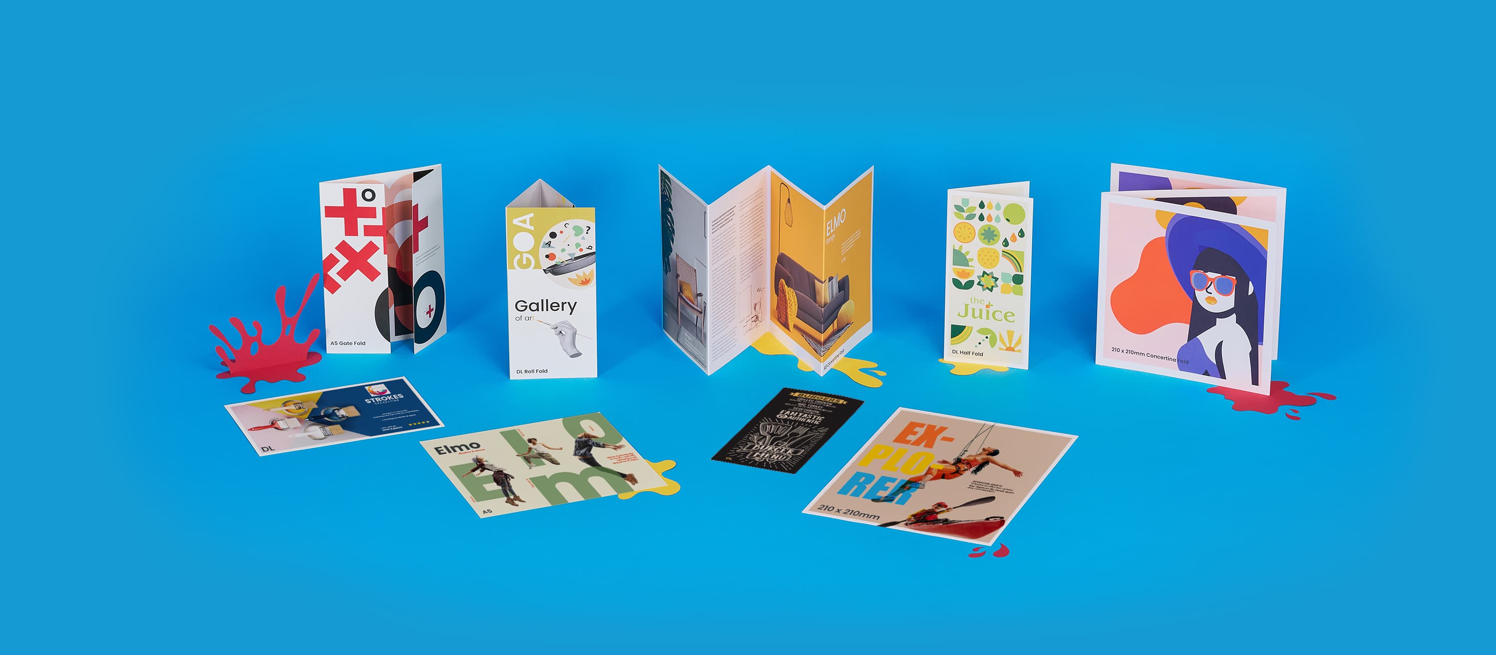 Colorful brochures and cards displayed on a blue background.