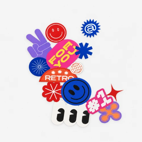 Assorted colourful window graphic stickers, including smiley faces, "FOR YOU," and "#1," on a gray background.