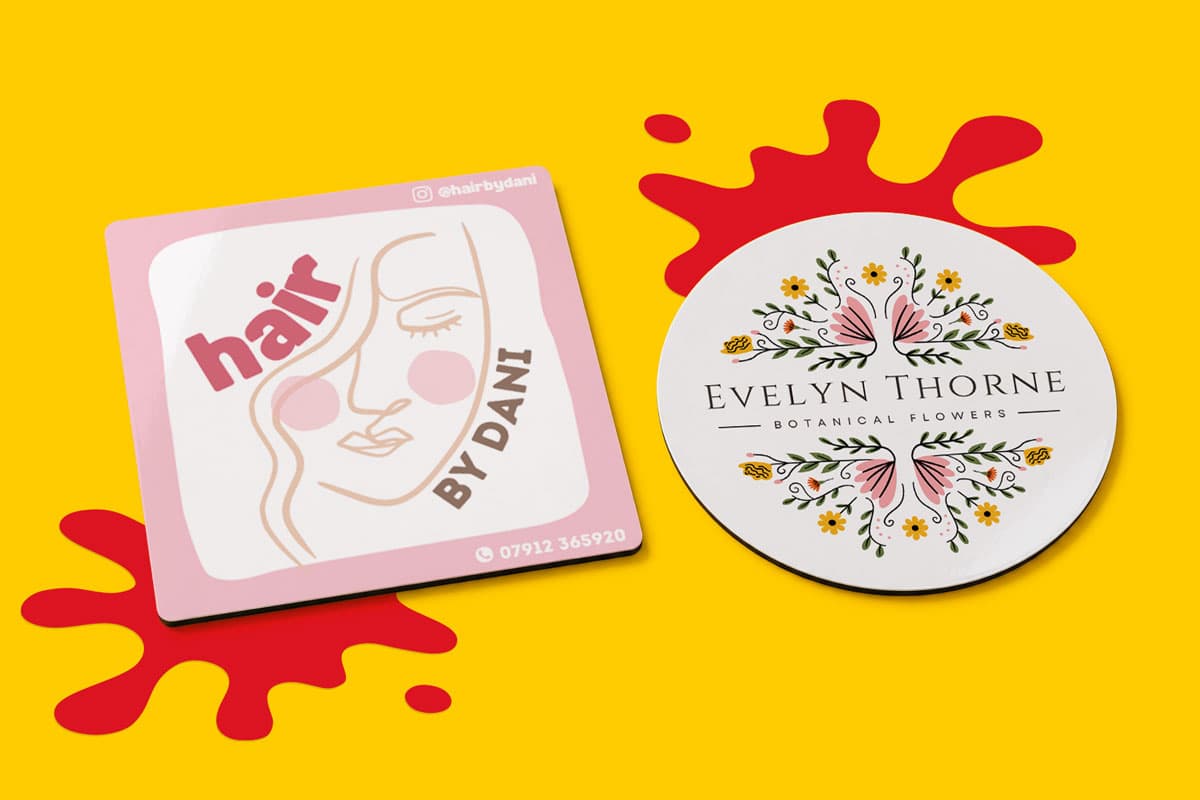Two round magnetic stickers on a yellow background with red paint splatters.
