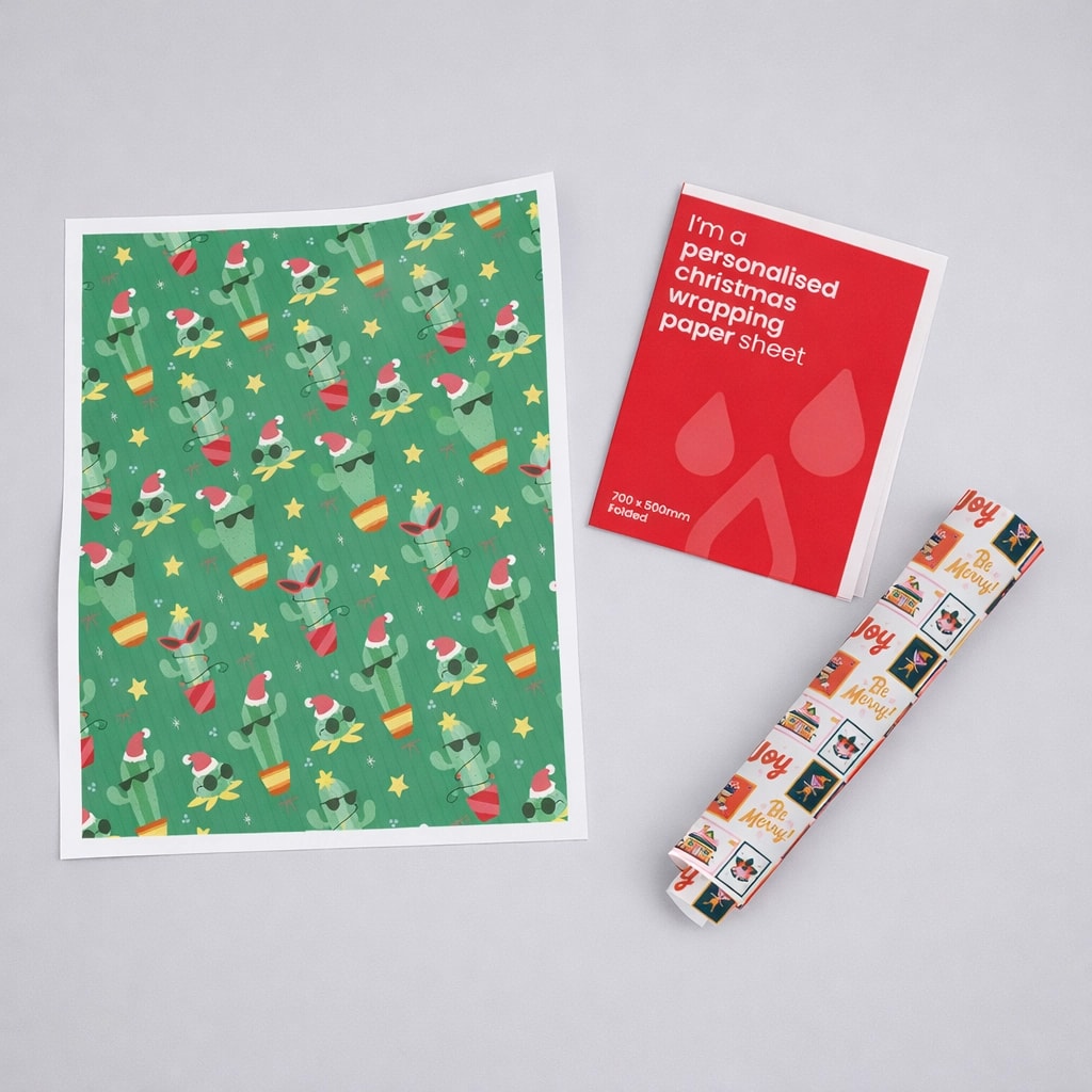 Christmas-themed cactus wrapping paper with Santa hats, shown flat, rolled, and with label.