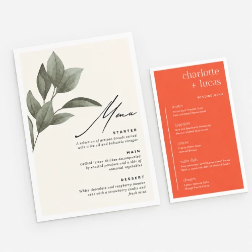 Two wedding menu cards with watercolor leaf accents and printed course selections.