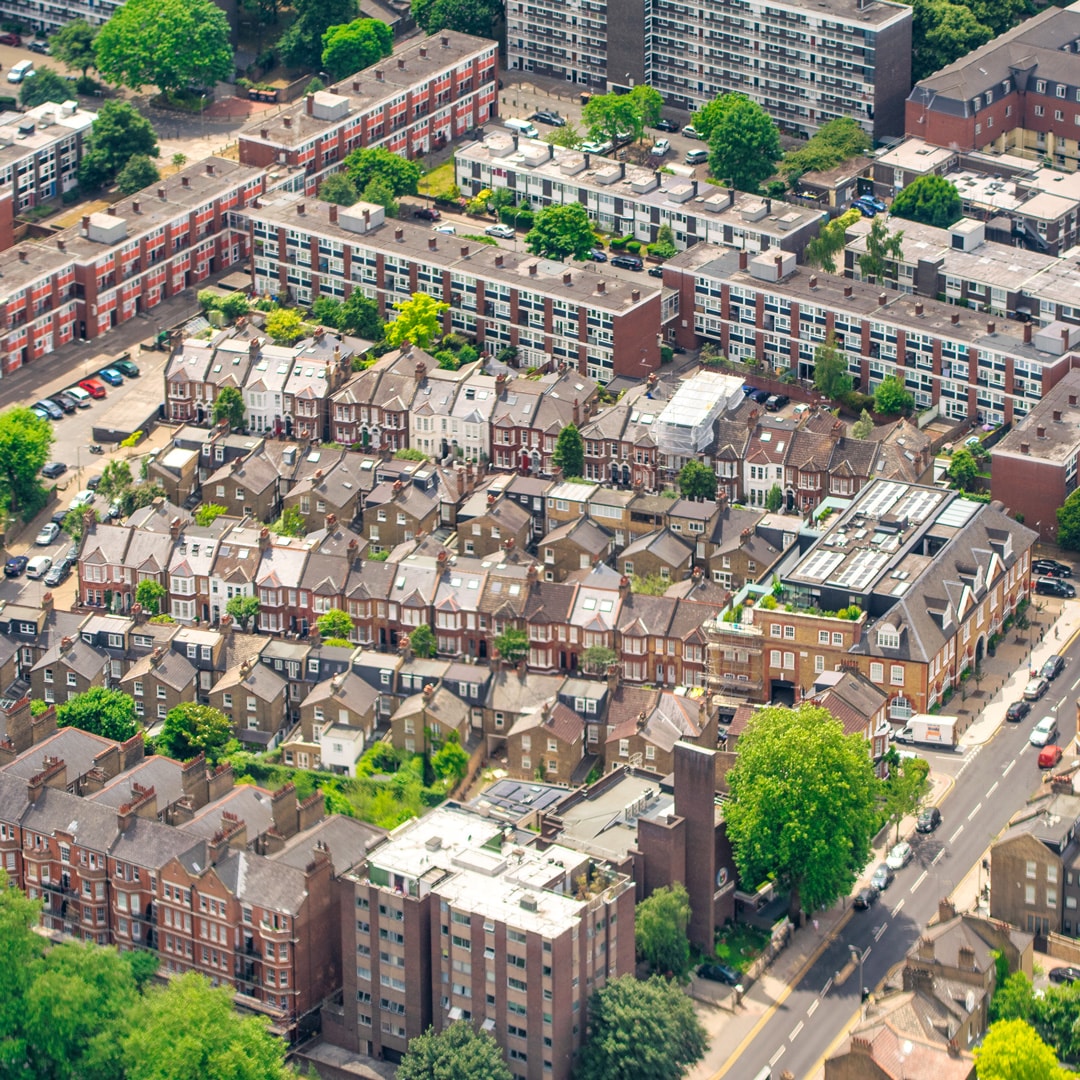 Aerial view of a residential neighborhood showcasing numerous houses and well-maintained streets.