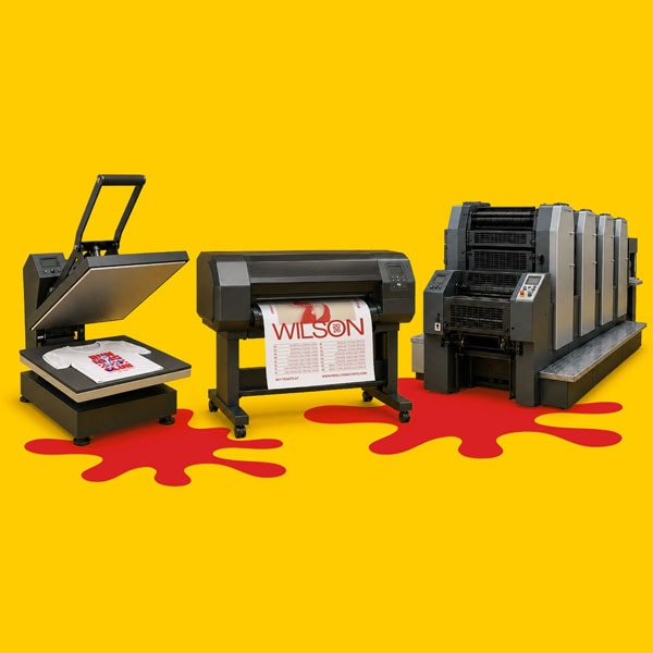 Three printing machines on a yellow background with red paint splashes beneath them.