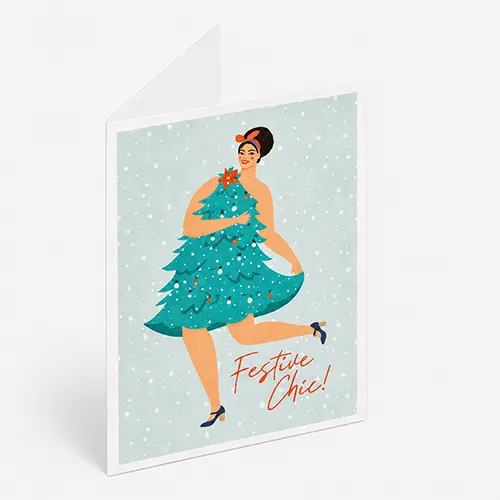 Greeting card with an illustration of a woman wearing a Christmas tree dress, text reads "Festive Chic!.