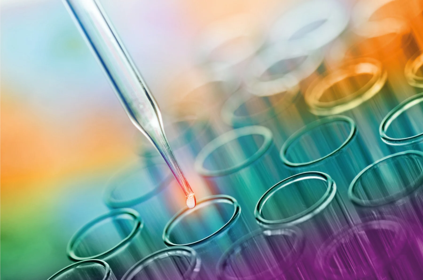 A detailed close-up of a test tube containing a vibrant liquid
