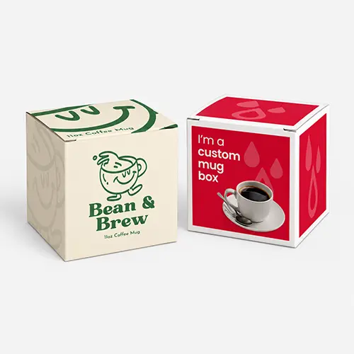 Two product boxes for a coffee mug, one cream-colored with green branding, one red with text.
