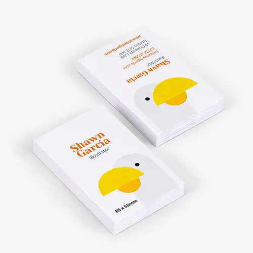 Two stacks of budget business cards with minimalist bird design and contact details for Shawn Garcia.