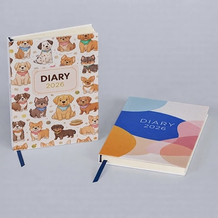 Two 2026 diaries, one with cartoon dogs on the cover and one with a colorful abstract design.