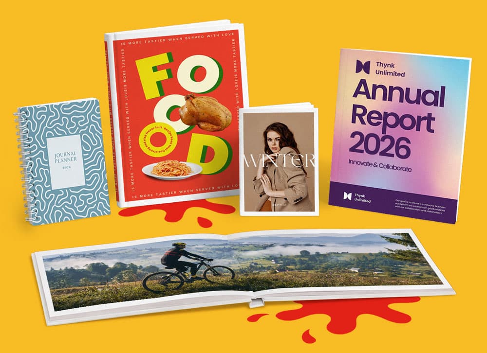 A group of assorted books and magazines displayed on a yellow background.