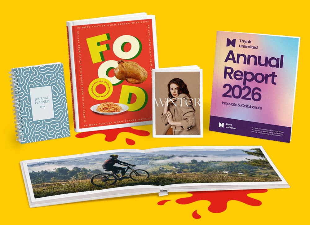 A group of assorted books and magazines displayed on a yellow background.