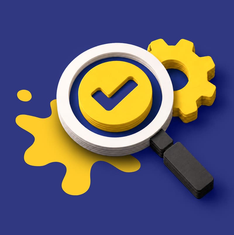 A magnifying glass over a yellow checkmark, with a gear and a paint splash behind it.
